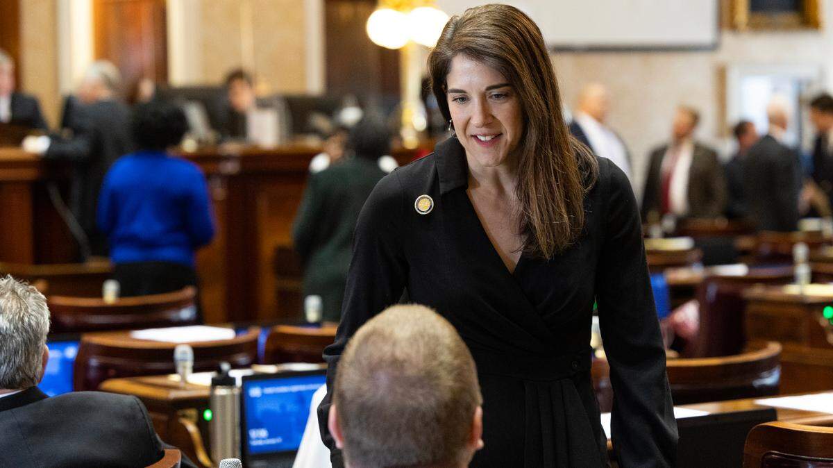 State Representative Heather Bauer, D-Richland, speaks with other lawmakers before the state of the legislative session in the South Carolina House on Tuesday, January 10, 2023.