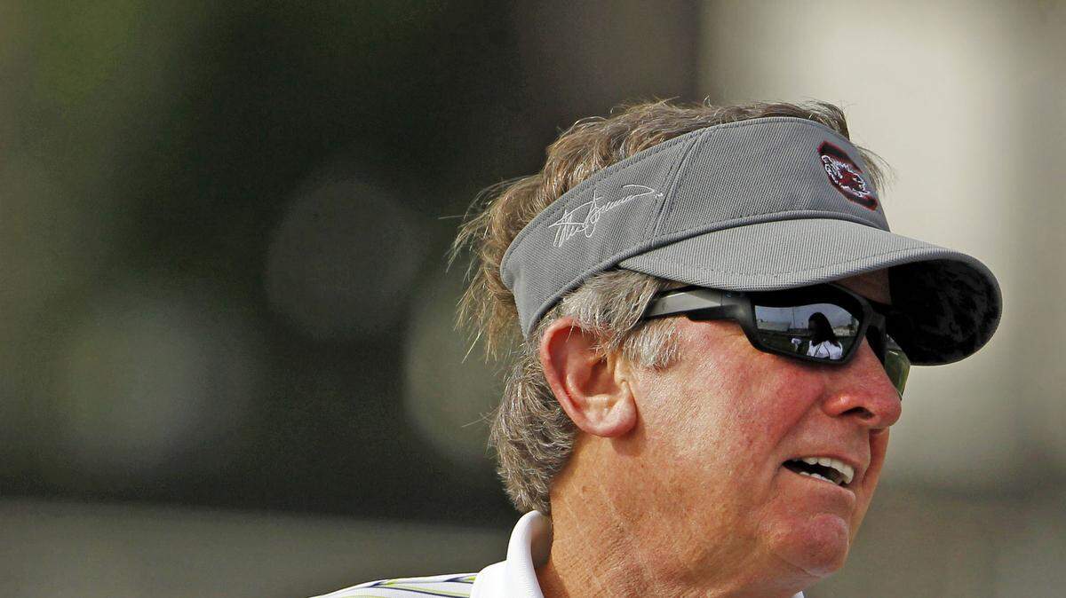 South Carolina head coach Steve Spurrier talks to defensive end Jadeveon Clowney (7) during practice at Jefferson High School in Tampa.