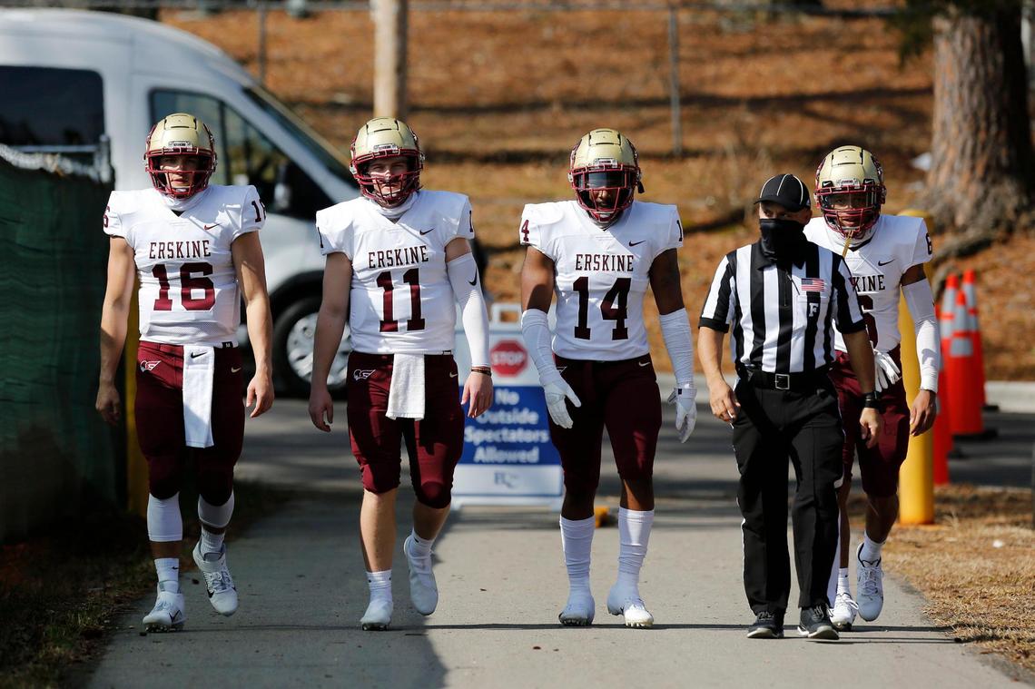 Erskine quarterback Lance Brownlee (16), quarterback Craig Pender (11), linebacker Brandon Lane (14) and defensive back Jaelan Harfield (6) take the field before the game against Barton.