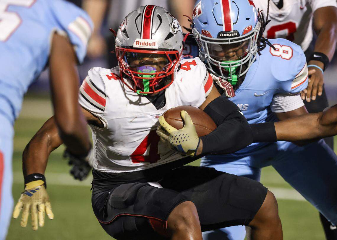 R.J. Brown (4) of South Pointe gets brought down by Jordan Davis (8) of AC Flora during AC Flora’s game against South Pointe at Memorial Stadium on Friday, September 19, 2025.