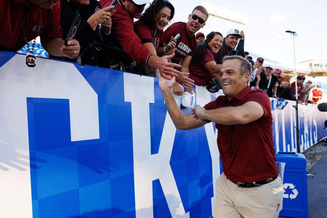 Sep 7, 2024; Lexington, Kentucky, USA; South Carolina Gamecocks head coach Shane Beamer high fives fans after the game against the Kentucky Wildcats at Kroger Field. Mandatory Credit: Jordan Prather-Imagn Images