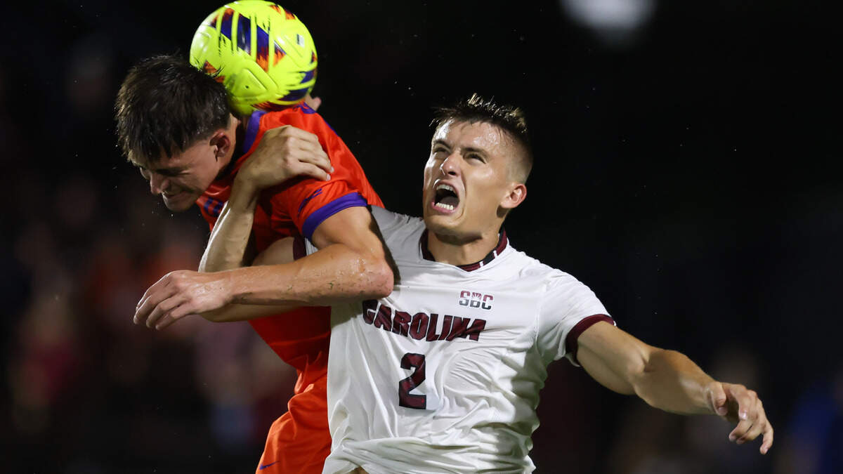 South Carolina defender Andrew Goldsworthy (2) and Clemson forward Tyler Trimnal (9) for up for a header during the Gamecocks’ game against Tigers in Columbia on Friday, August 30, 2024.