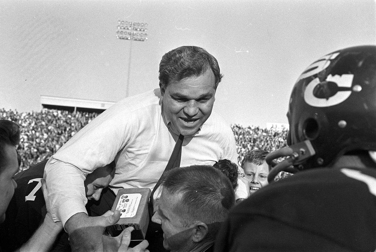 Marvin Bass is carried off the field by his 1965 USC team after it defeated Clemson 17-16 in what turned out to be the final game of Bass’ five-year tenure with the Gamecocks.