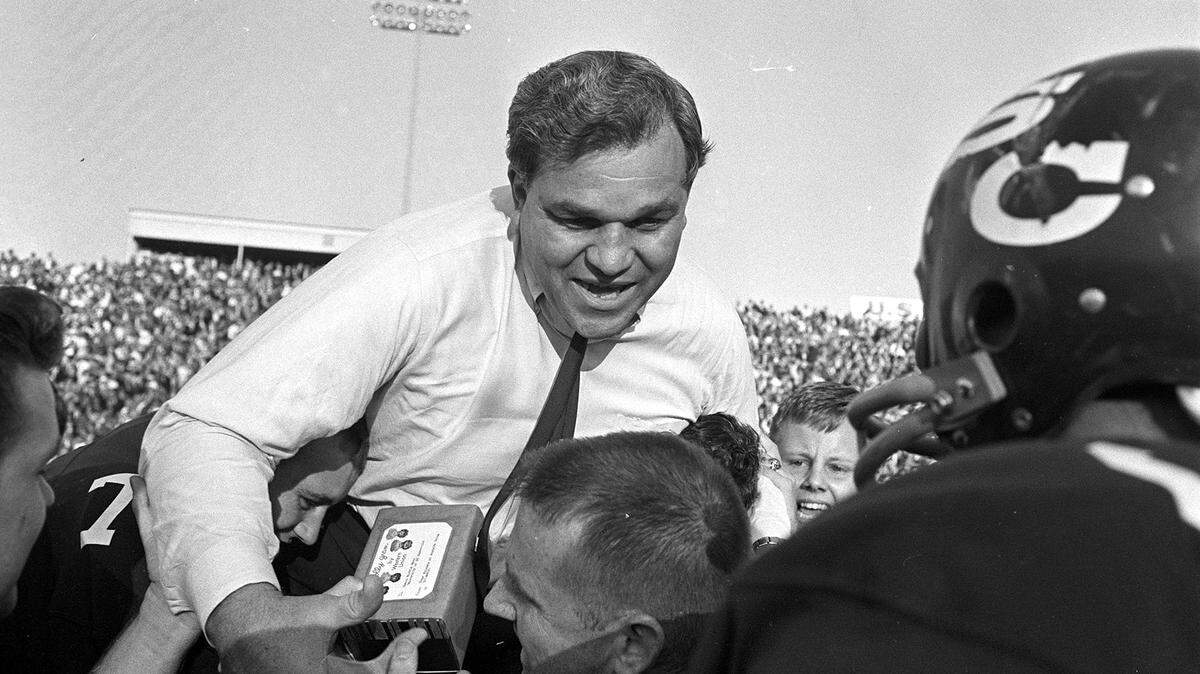 Marvin Bass is carried off the field by his 1965 USC team after it defeated Clemson 17-16 in what turned out to be the final game of Bass’ five-year tenure with the Gamecocks.