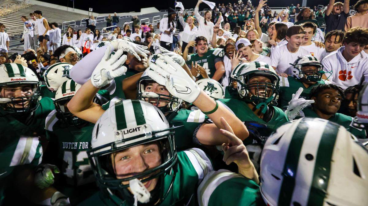 Dutch Fork Silver Foxes players celebrate with fellow students after winning the 5A State Championship Game Friday, Dec. 1, 2023, at South Carolina State’s Oliver Dawson Stadium in Orangeburg, SC.