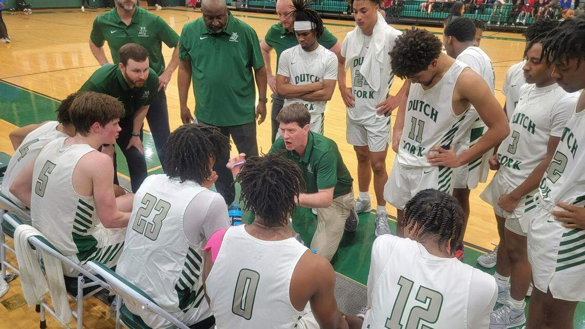 Dutch Fork coach Bret Jones talks to his team during a timeout Monday during a Class 5A playoff game against Sumter.