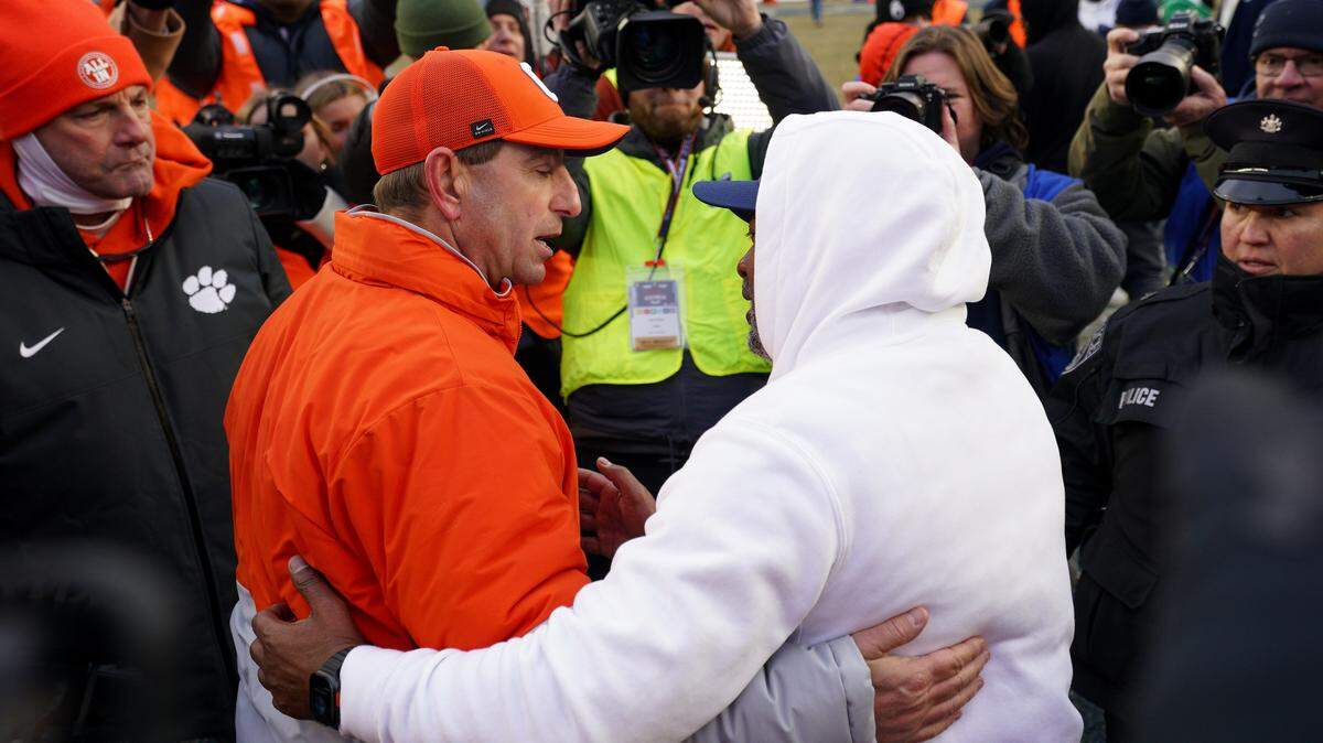 Clemson football and coach Dabo Swinney (left) had some soul-searching to do regardless of Saturday’s bowl game result, but a loss to Penn State and outgoing interim coach Terry Smith (right) was salt in the wound.