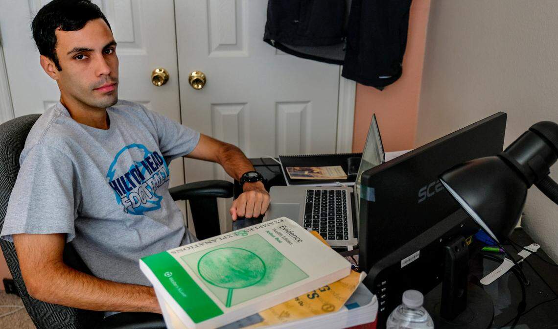 Kebin Lopez, 25, a DACA recipient, sits for a portrait on April 22, 2021 in his childhood room in Bluffton, S.C. where he remotely attends law school at the University of Florida.