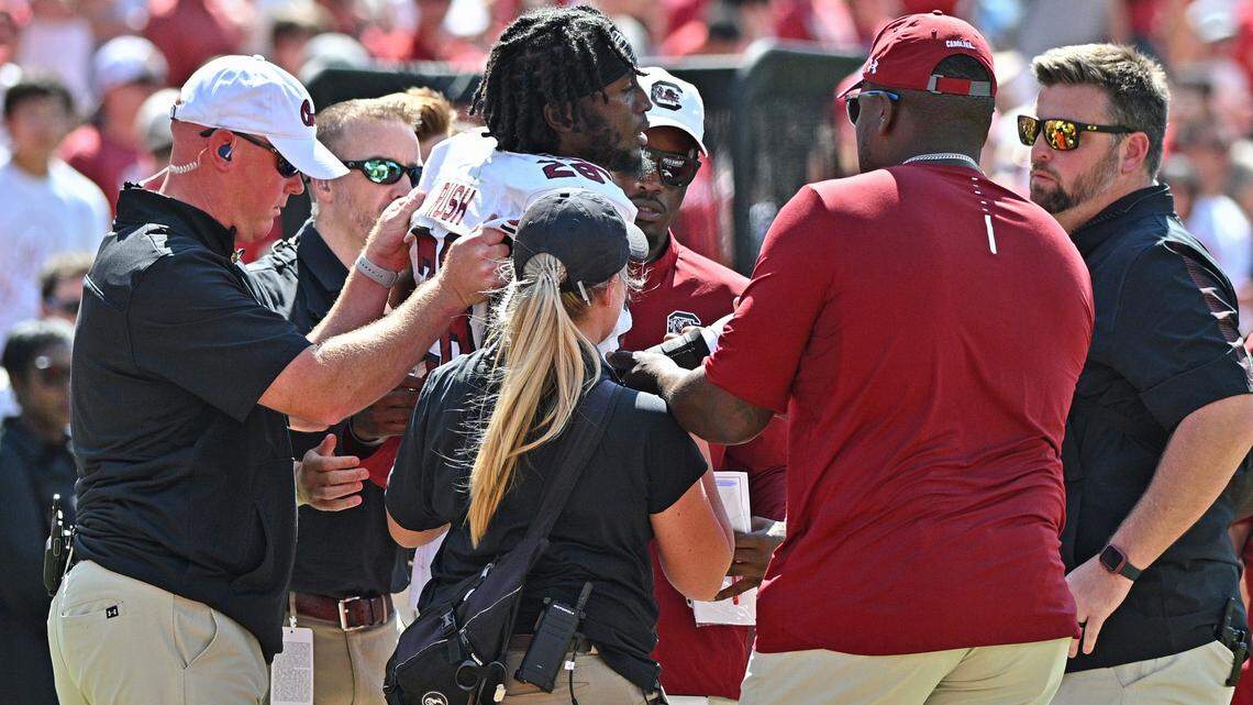 South Carolina defender Darius Rush (28) getting assistance from training staff at Donald W. Reynolds Razorback Stadium in Fayetteville, Arkansas on Sept. 10, 2022.