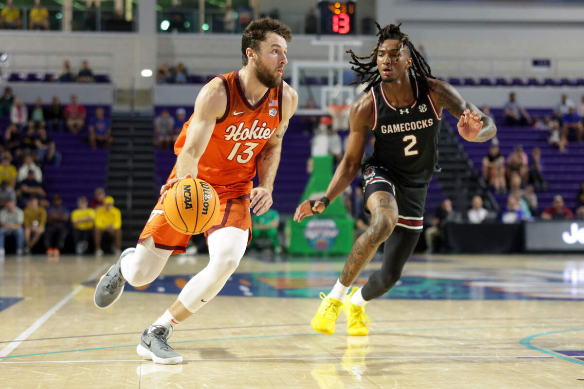 Virginia Tech Hokies forward Ben Burnham (13) drives to the hoop past South Carolina Gamecocks guard Zachary Davis (2) in the first half at Suncoast Credit Union Arena.