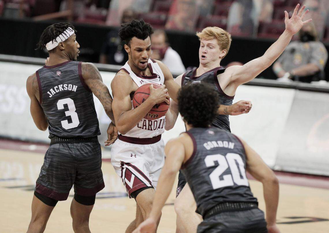 South Carolina Gamecocks guard AJ Lawson (00) is guarded by multiple Texas A&M players at Colonial Life Arena on Wednesday, January 6, 2021.