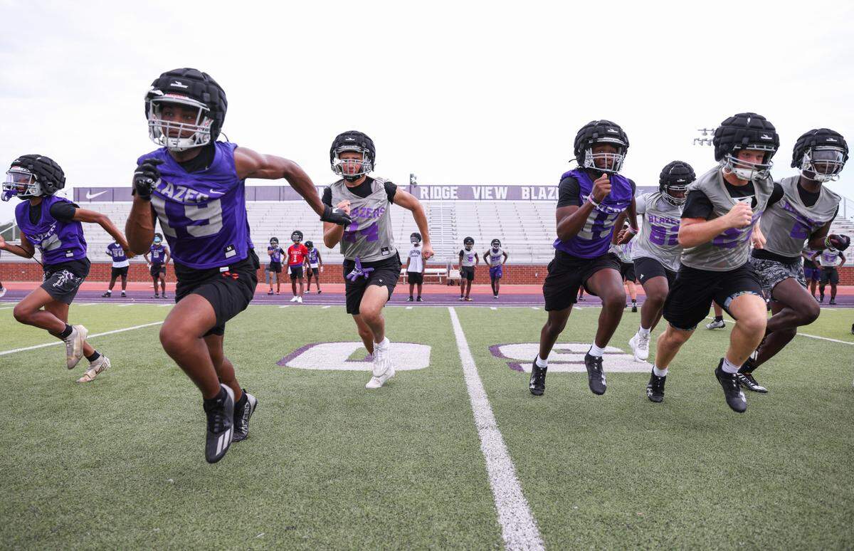 Players runs drills during the first day of practice at Ridge View High School in Columbia on Friday, July 28, 2023.