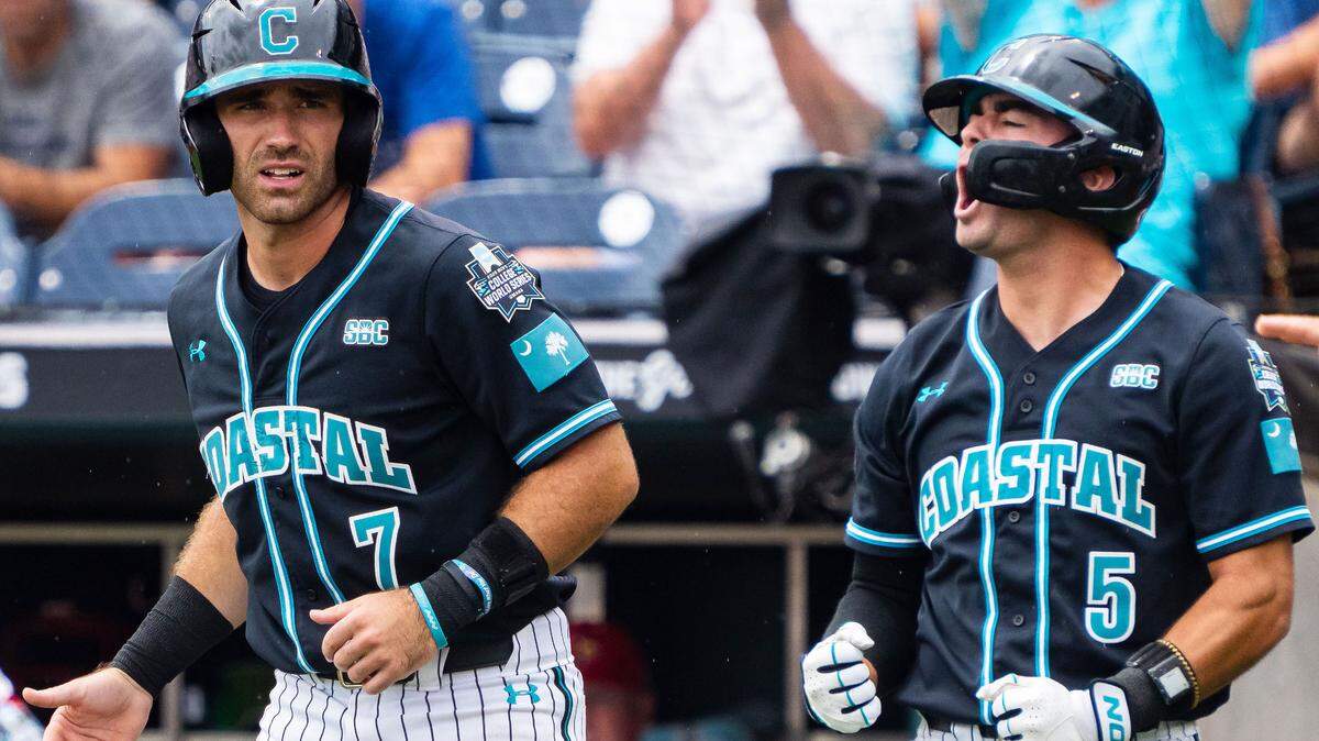 Coastal Carolina Chanticleers third baseman Walker Mitchell (5) yells after scoring on a three RBI double against the Louisville Cardinals during the first inning at Charles Schwab Field.