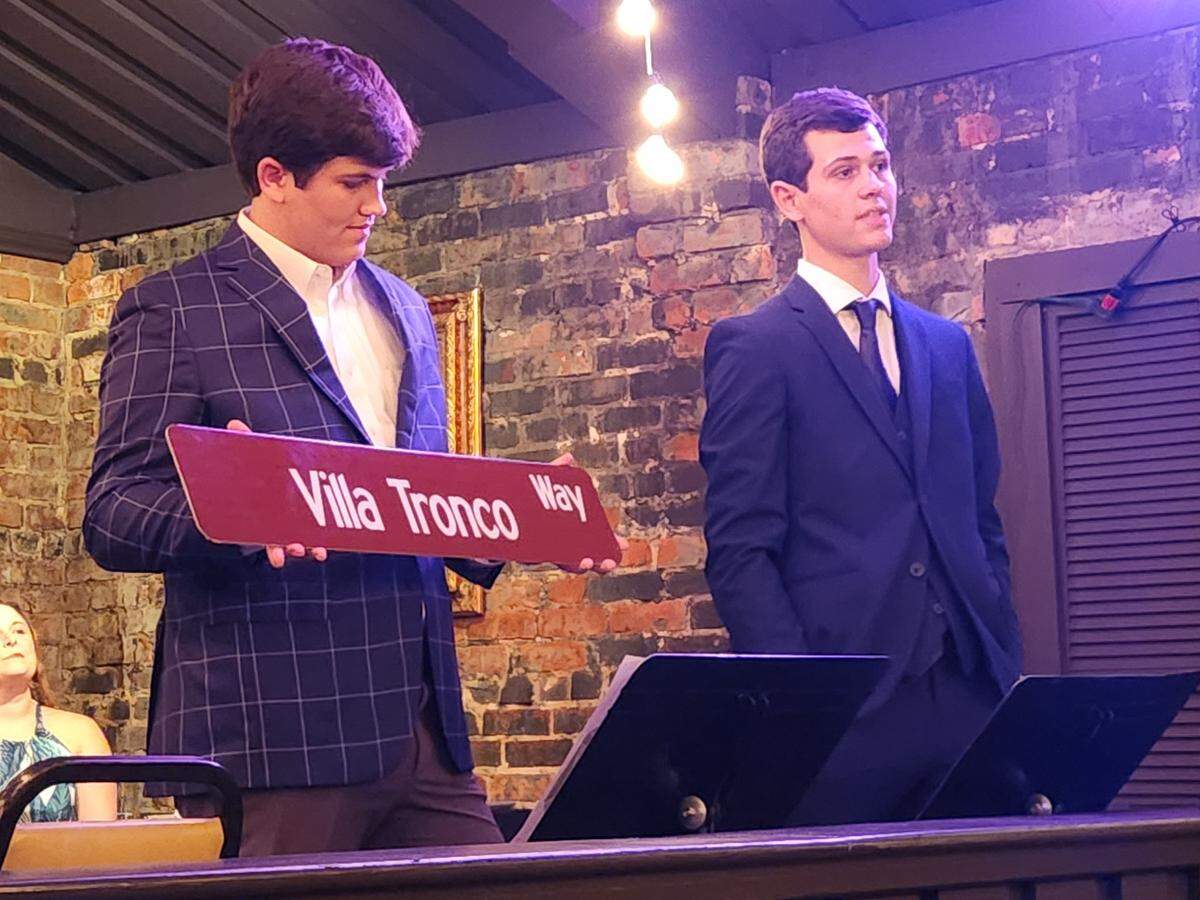 Brothers, from left, Donovan, and Tripp Roche speak Sept. 12, 2024 at Villa Tronco restaurant during a ceremony unveiling a street sign for Villa Tronco Way. Columbia City Council has honorarily named the 1200 block of Blanding Street for the restaurant.