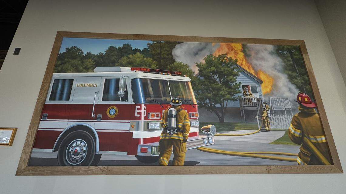 A mural depicting firefighters is shown at the new Firehouse Subs at 10136 Two Notch Road in Sparkleberry Square.