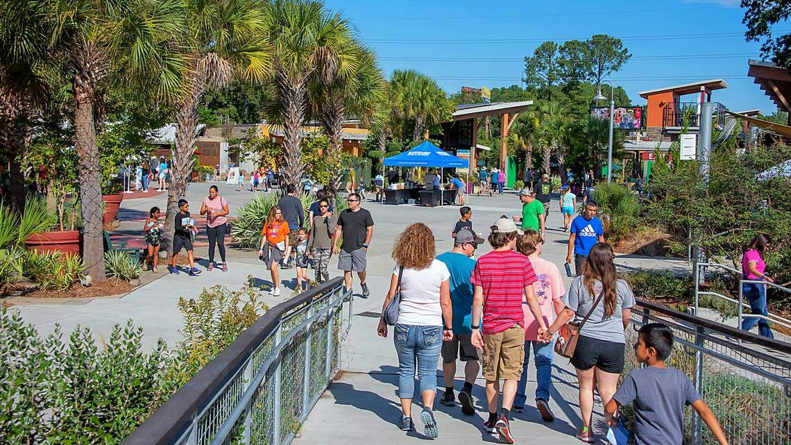 Crowds walk through Riverbanks Zoo and Garden in Columbia.