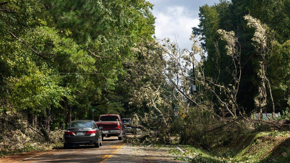 Trees knocked over by Hurricane Helene block traffic and down power lines in Lexington, South Carolina on Friday, September 27, 2024.