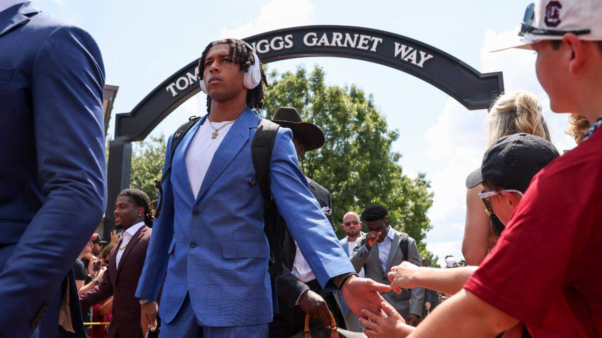South Carolina quarterback Robby Ashford (4) greets fans during the Gamecock walk before South Carolina’s season opener against Old Dominion in Columbia on Saturday, August 31, 2024.