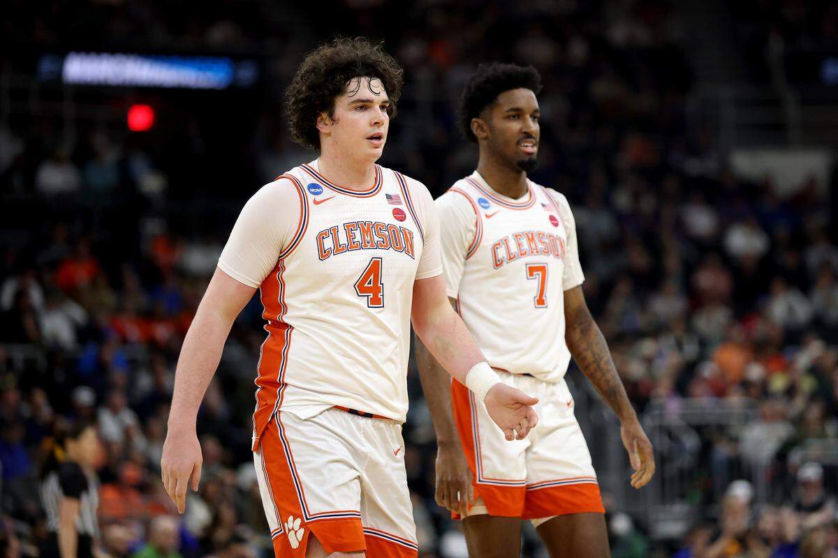 Forward Chauncey Wiggins (7), pictured here with teammate and friend Ian Schieffelin (4), played nearly 100 games for the Clemson men’s basketball team from 2022-25.