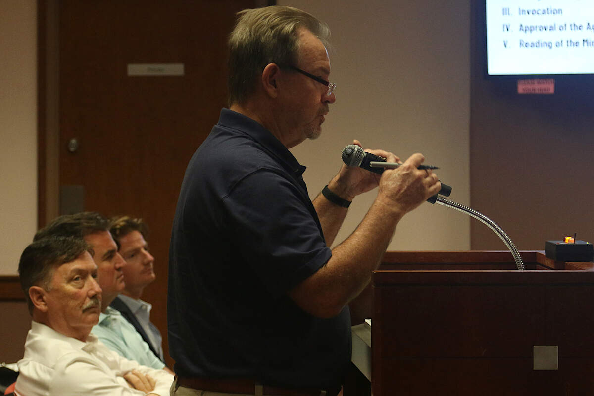 A resident lists concerns with the proposed Water Walk project at an Irmo Town Council meeting as developers look on Tuesday, Sept. 17, 2024.