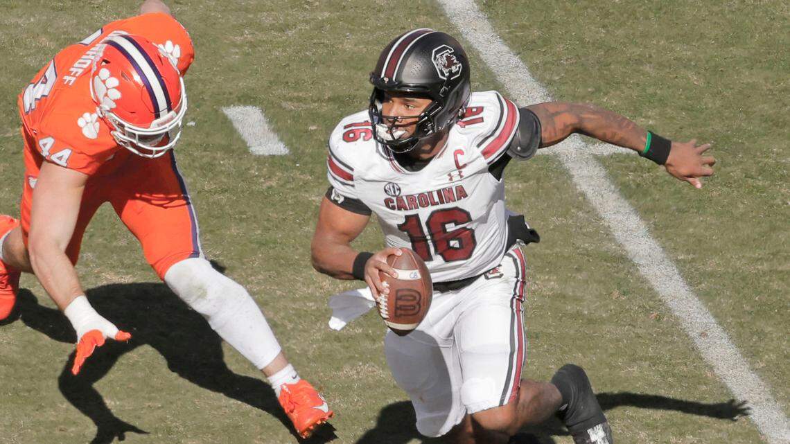 South Carolina quarterback LaNorris Sellers (16) scrambles away from Clemson defensive end Cade Denhoff (44) during first-half action in Clemson on Saturday.