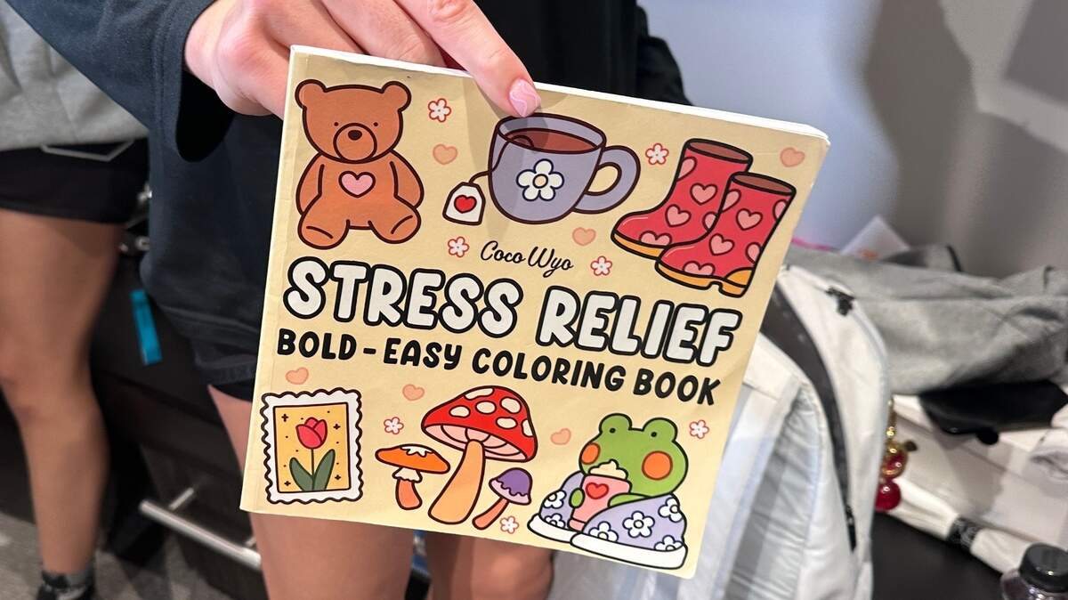 South Carolina’s Chloe Kitts draws in this coloring book before games to keep herself calm.