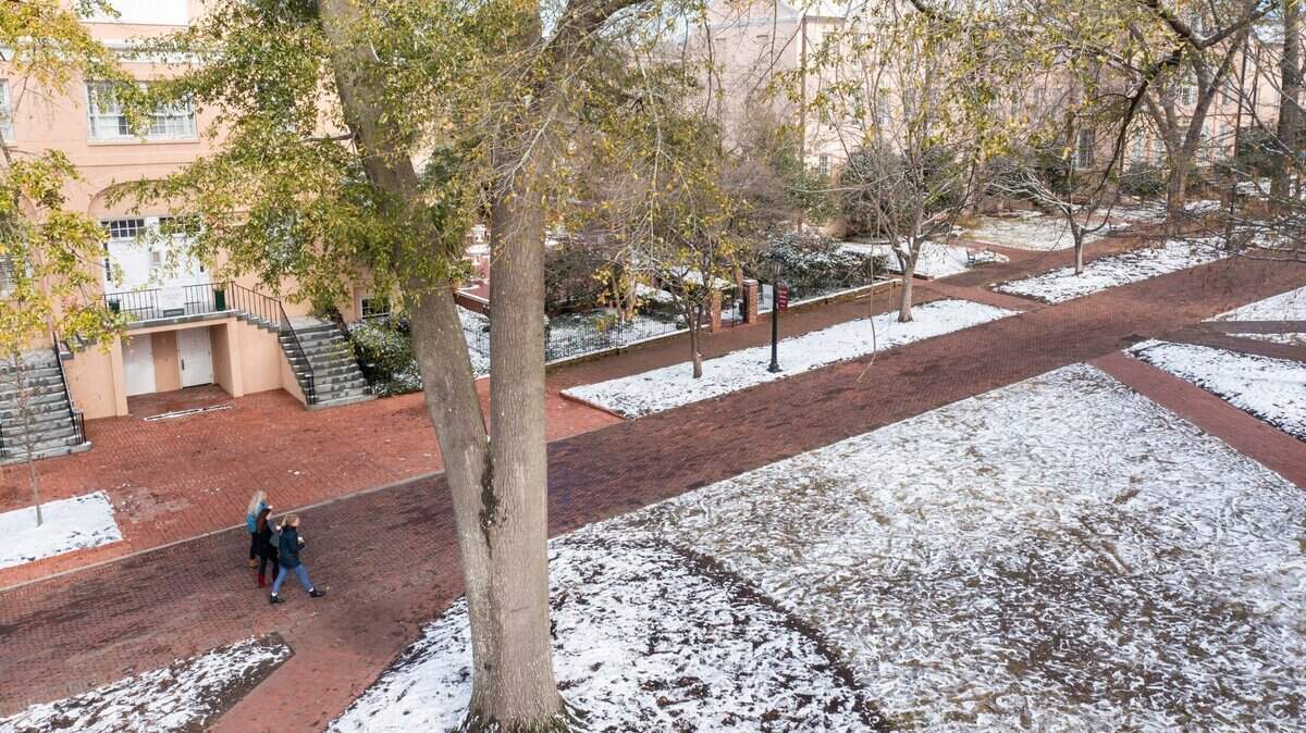 Drone photo of students walking on the University of South Carolina Horseshoe with snow in downtown Columbia, SC, on January 22, 2022.