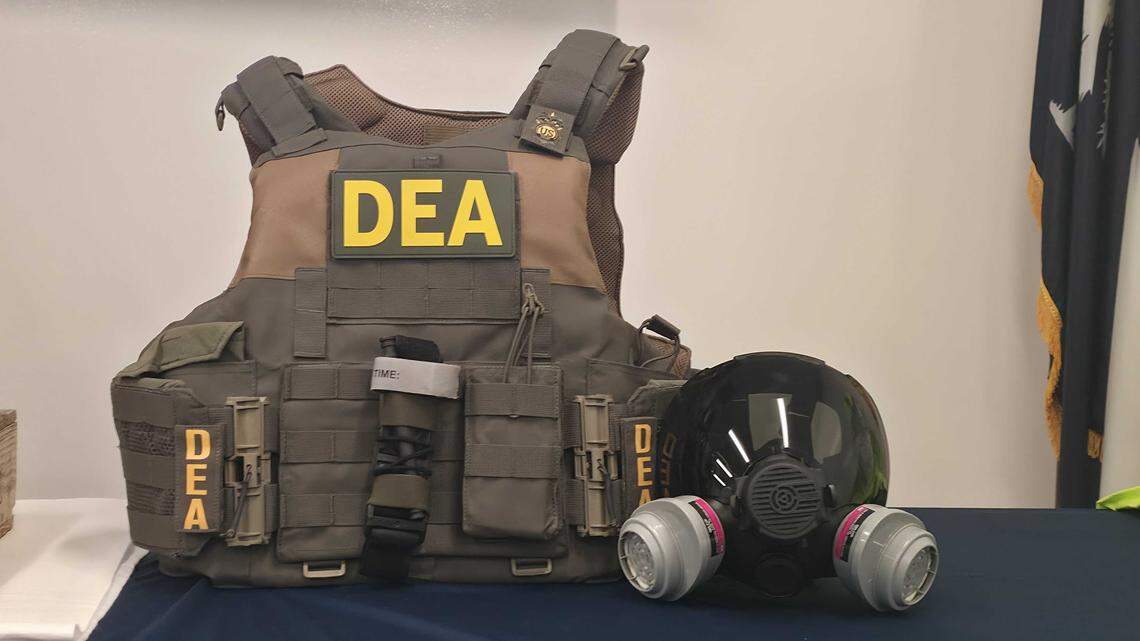 DEA South Carolina displays a bullet proof vest and gas mask during a media briefing on Sept. 17, 2025.