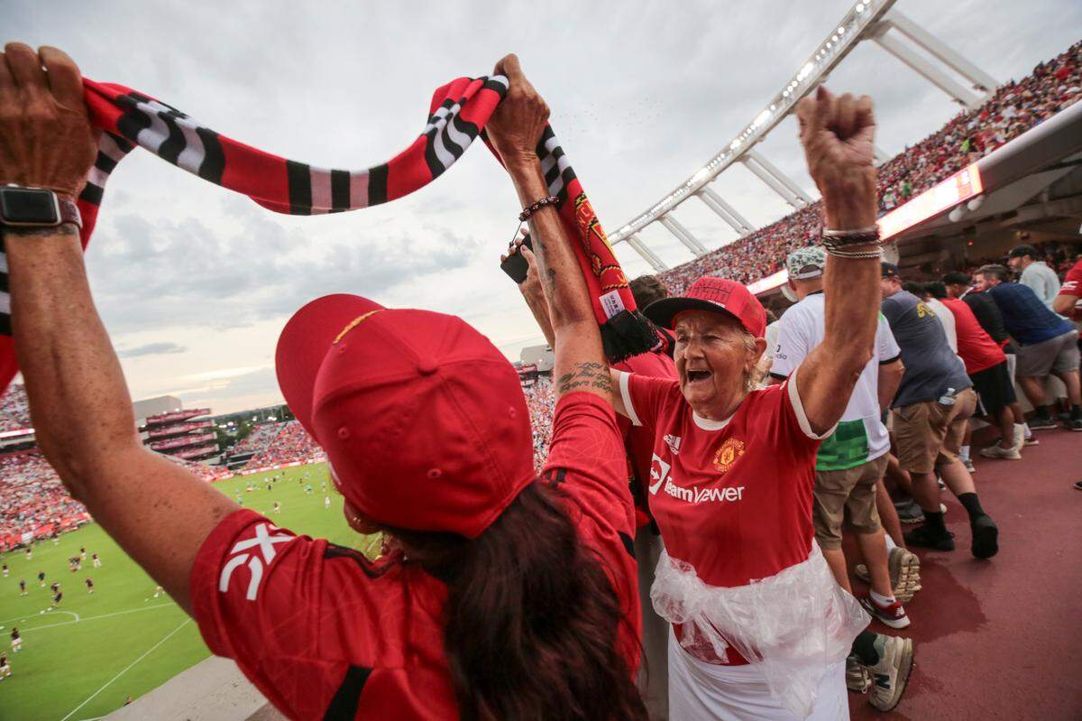 Janet Whittle, right, and her daughter Tracey Lee celebrate Manchester United while the teams are introduced on Saturday, Aug. 3, 2024 Williams-Brice Stadium. Whittle, 81, said attending this game was a bucket-list item for her, having moved to South Carolina from England 35 years ago.