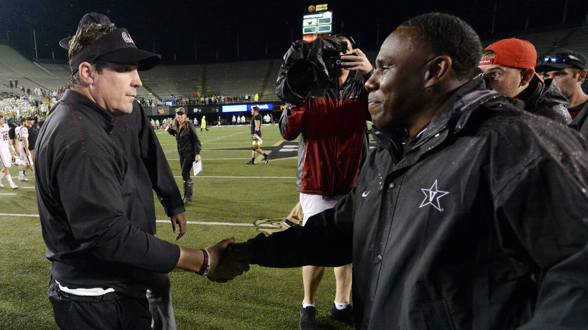 South Carolina head coach Will Muschamp, left, is congratulated by Vanderbilt head coach Derek Mason after an NCAA college football game against Vanderbilt Saturday, Sept. 22, 2018, in Nashville, Tenn. South Carolina won 37-14. (AP Photo/Mark Zaleski)