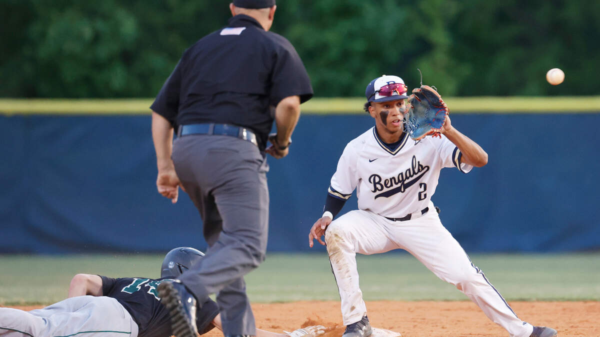 River Bluff’s Logan Busbee 14 slides into second as Blythewood’s Xavier Cuevas tries to tag him out in the South Carolina High School League Class 5A championship on Wednesday, May 24, 2023.