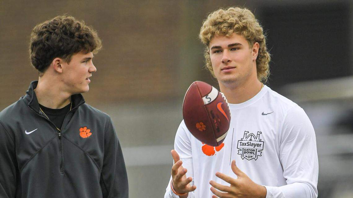 Drew Woodaz, left, and Sammy Brown, signees, watch Clemson football team practice before the TaxSlayer Gator Bowl at Fernandina Beach High School in Jacksonville, Florida, Wednesday, December 27, 2023.