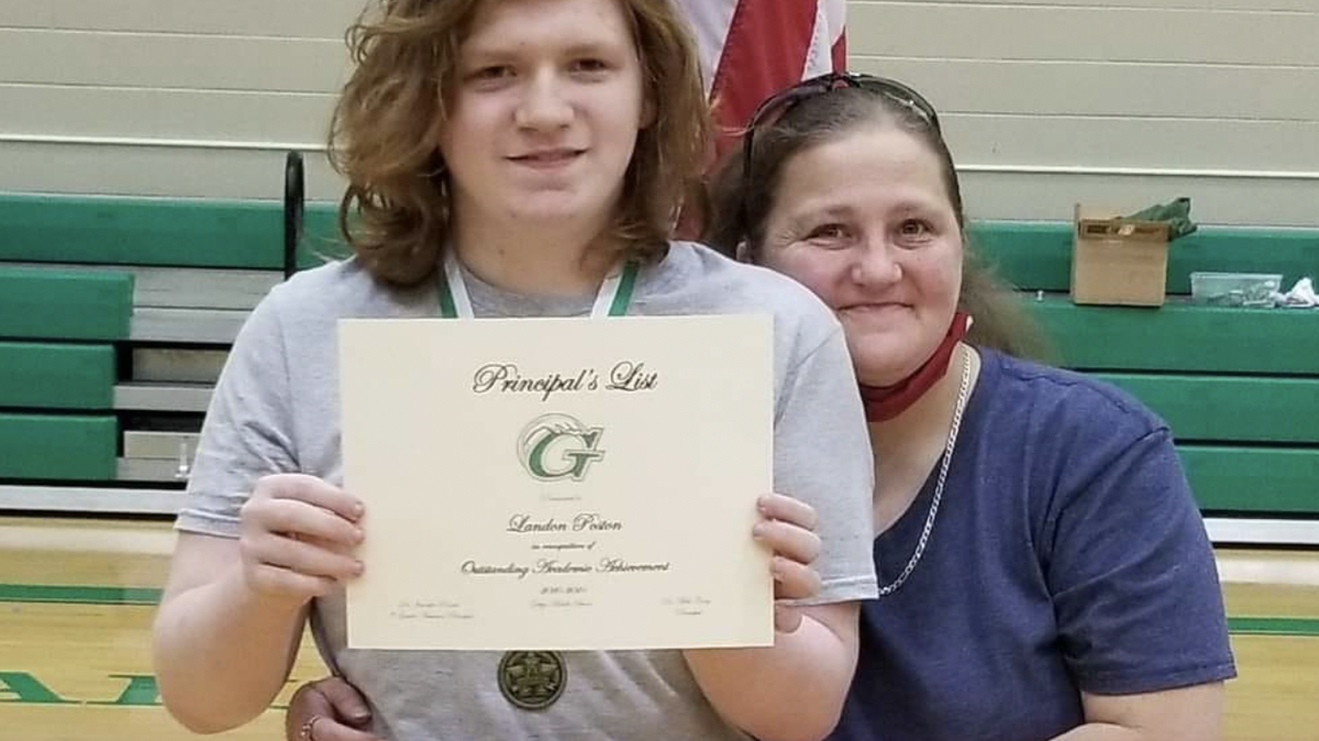 Landon Poston is shown with the principal’s award for making straight As in middle school. He was found dead in a Greenville hotel room on Monday. His mother, shown above, was found unconscious in the room.