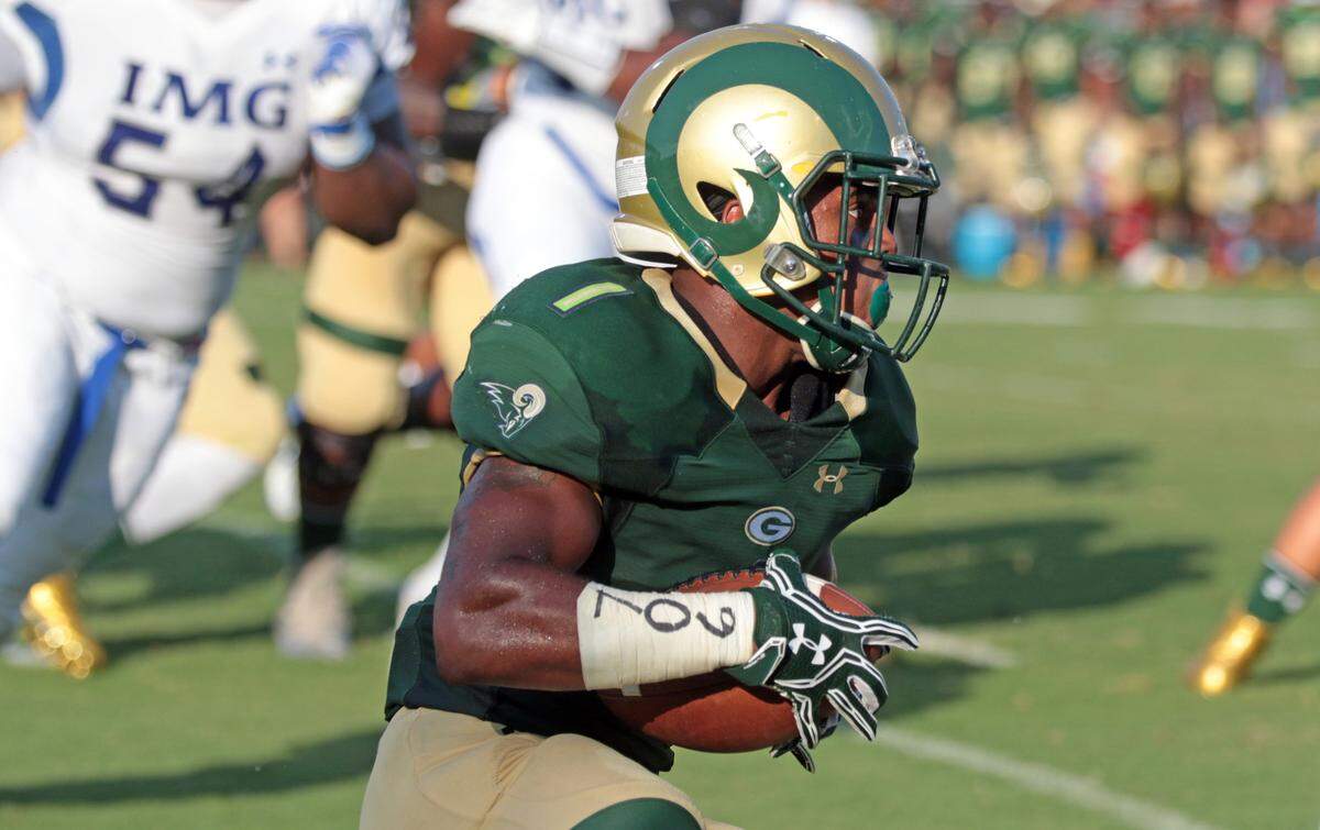 Grayson High’s Jamyest Williams runs the ball against IMG Academy on Aug. 27, 2016.