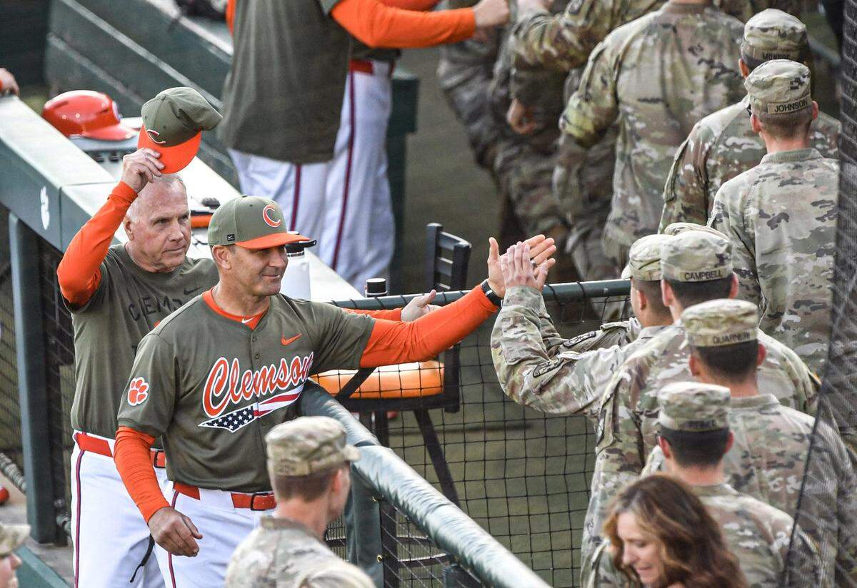 Clemson baseball coach Erik Bakich greets senior class Clemson ROTC members after they were recognized on the field during the program’s military appreciation game vs. Gardner-Webb at Doug Kingsmore Stadium on April 9, 2025