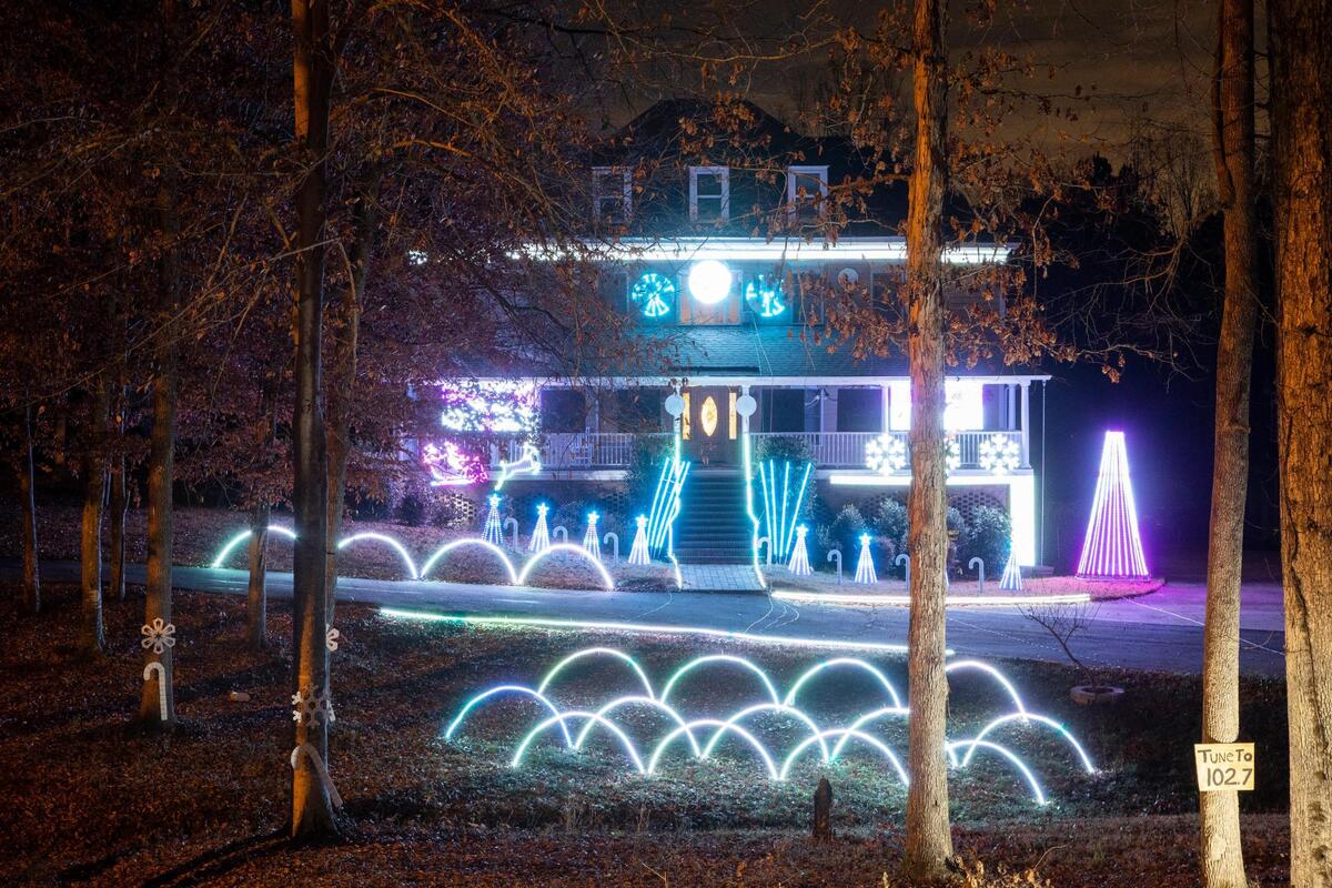 A music synchronized light display on Timber Knoll Drive in Irmo, South Carolina on Wednesday, December 23, 2020. Dozens of cars parked to watch and listen to the holiday show.