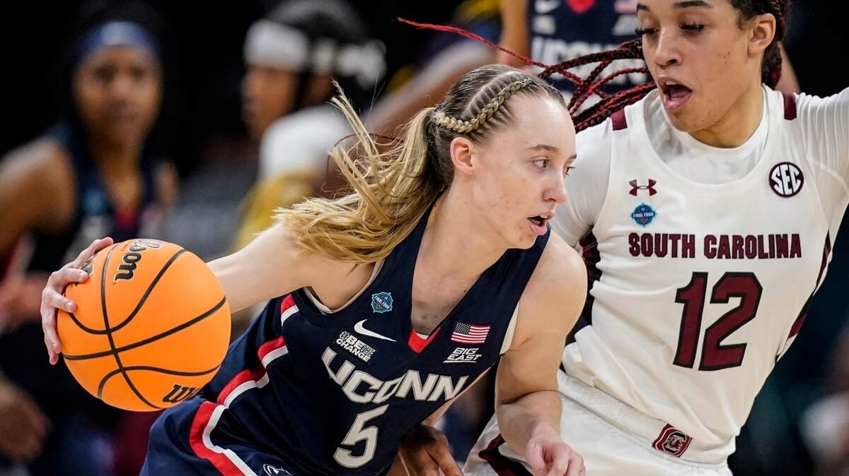 UConn’s Paige Bueckers tries to get past South Carolina’s Brea Beal during the national championship game April 3 in Minneapolis.