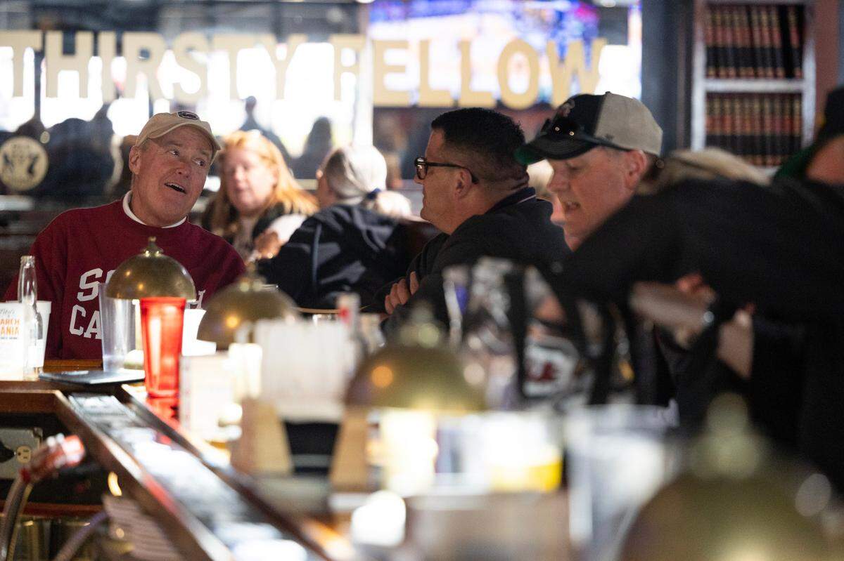 Basketball fans eat, drink and watch the games happening at the nearby Colonial Life Arena at Thirsty Fellow on Friday, March 21, 2025.
