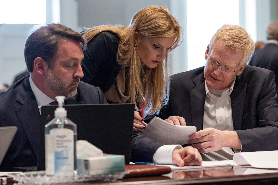 Alex Murdaugh reviews notes during jury selection with members of his defense team, Phil Barber and Maggie Fox.