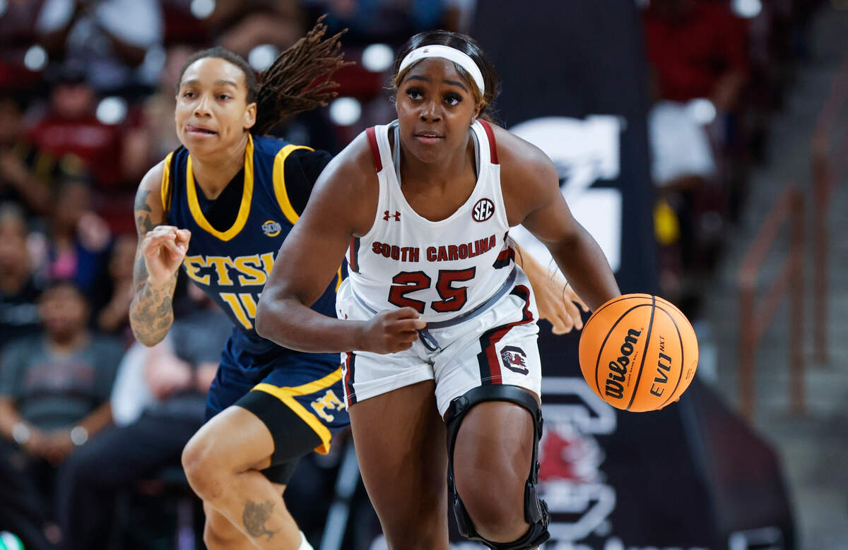 South Carolina’s Raven Johnson (25) drives past East Tennessee State’s Jayla Ruffus-Milner (14) in the Carolina Coliseum on Monday, Nov. 07, 2022.