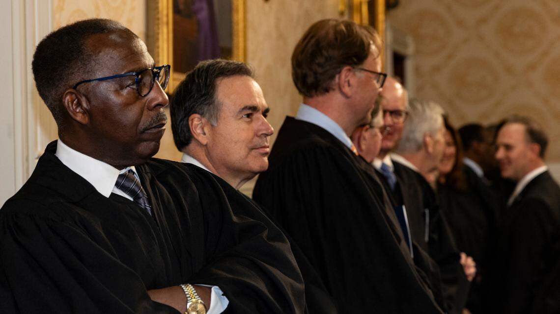 South Carolina Chief Justice Donald Beatty, left, and the rest of the South Carolina Supreme Court, including Justice Donald Kittredge and justice John Few attend the State of the State address in the S.C. House  Chamber on Wednesday, Jan. 24, 2024
