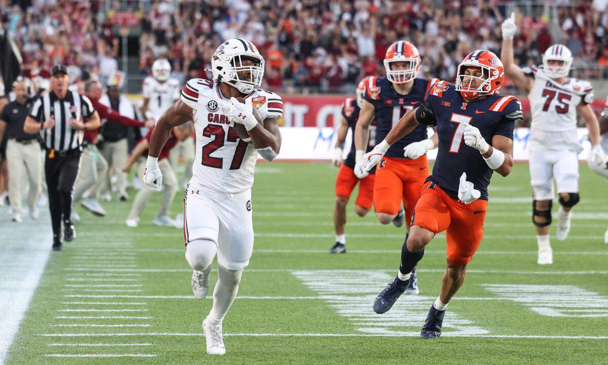 South Carolina running back Oscar Adaway III (27) scores a touchdown during the Cheez-It Citrus Bowl at Camping World Stadium in Orlando, Florida on Tuesday, December 31, 2024.