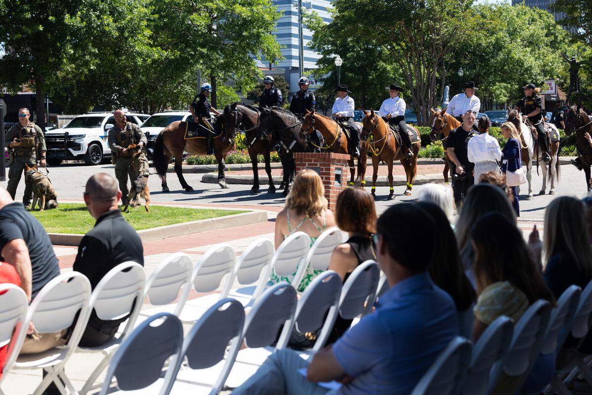 Handlers wait their animals during a ceremonial bill signing of a law increasing penalties for those who harm law enforcement animals at the Columbia Metropolitan Convention Center on Wednesday, June 3, 2026.