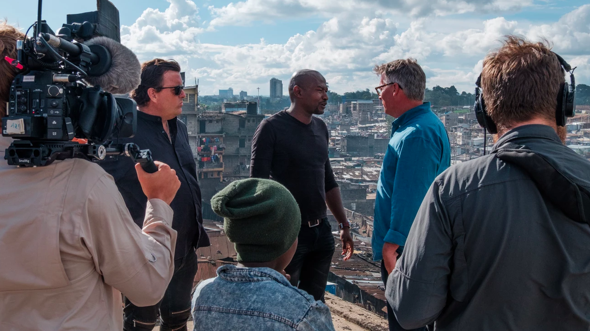 University of South Carolina alumnus Earl Bridges and co-host Craig Martin interview sources for their docuseries The Good Road. 