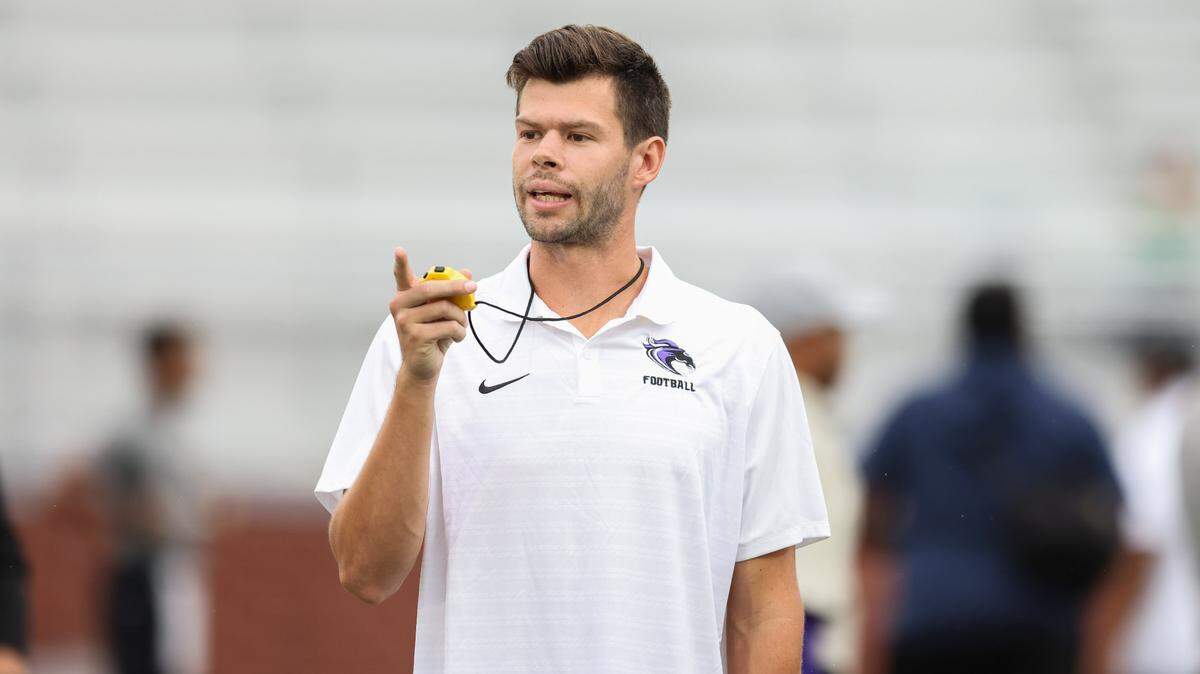 Ridge View assistant coach Parker White speaks with players before Ridge View’s game against Dutch Fork in Columbia on Friday, September 6, 2024.