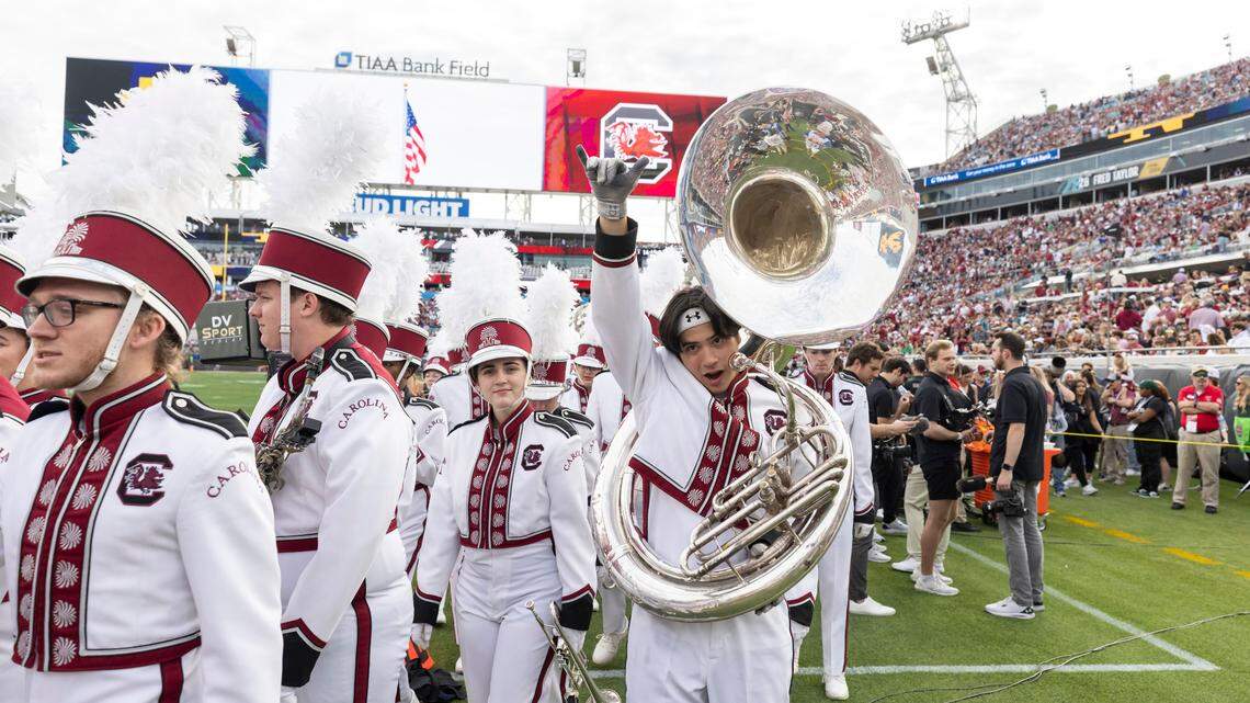 Members of the Gamecocks marching band enter the field before the Gator Bowl at TIAA Bank Field in Jacksonville, Florida, on Friday, Dec. 30, 2022.
