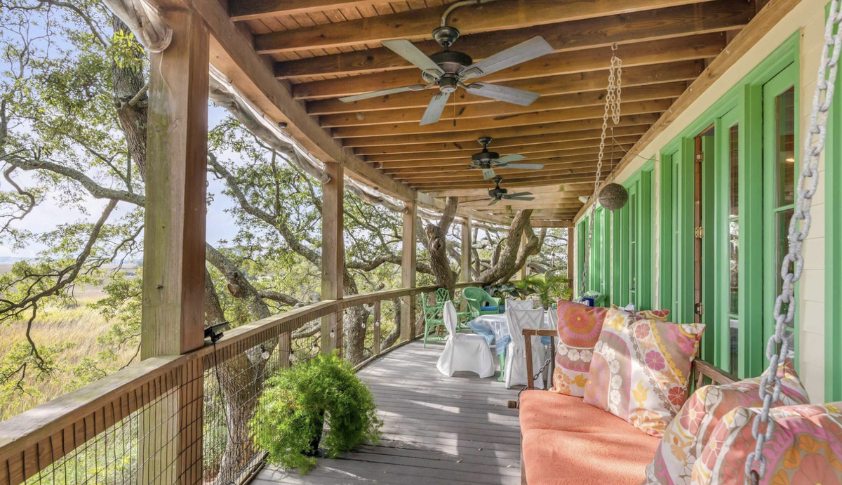 The house has numerous patios to enjoy the march scenery and coastal breezes.