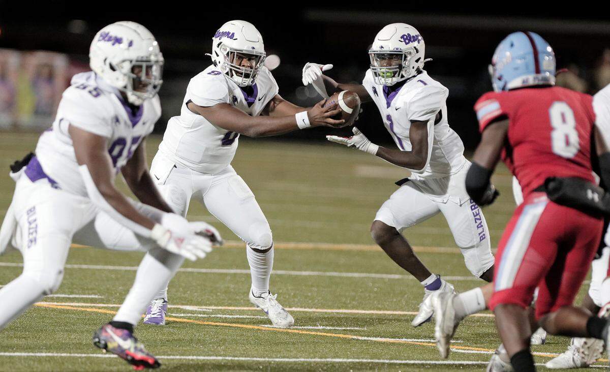 Ridge View’s Breylon Boyd fakes a handoff to Marcus Kelly during the game against AC Flora Memorial Stadium in Columbia on Friday, Oct. 28, 2022.