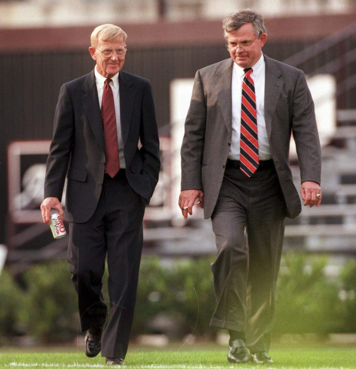 Lou Holtz takes the field on Dec. 4, 1998, with USC Athletic Director Mike McGee before he was officially introduced as the new head coach of the USC Gamecocks 