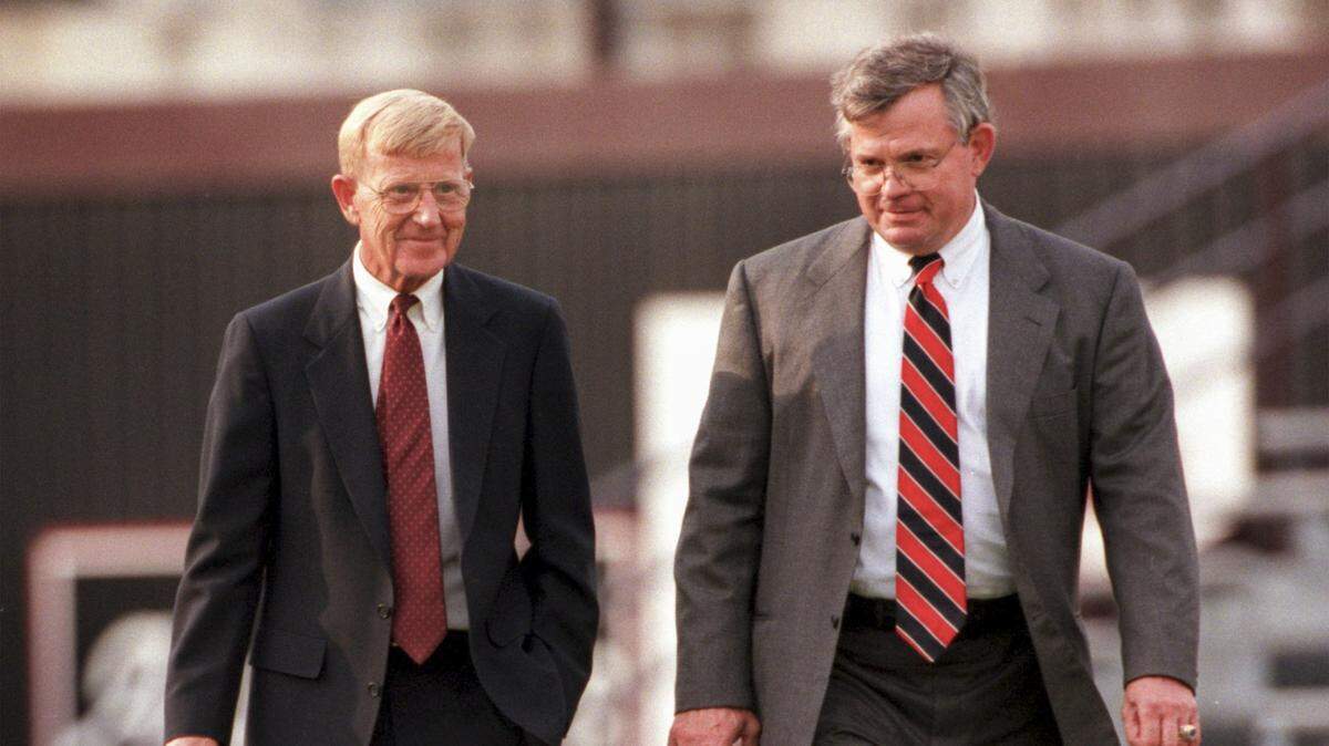 Dec. 4, 1998: Lou Holtz takes the field at Williams-Brice Stadium with USC Athletic Director Mike McGee before being officially introduced as the new head coach of the USC Gamecocks.